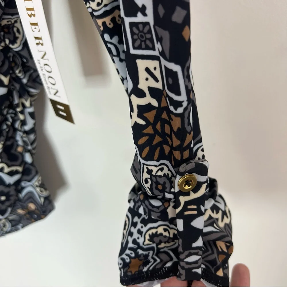Ambernoon II by Dr. Erum Ilyas Floral Print 1/4 Zip Roll Tab Sleeve Rash Guard